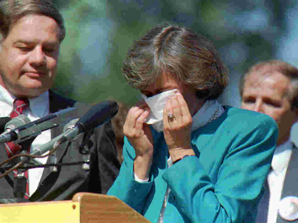 U.S. Rep. Patricia Schroeder wipes her eyes at a 1987 news conference in Denver.