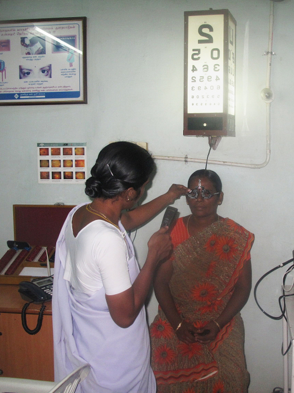 A woman receives an eye exam at one of Aravind's 36 small satellite eye care centers, in the village of Alanganallur, about 15 miles from Madurai.