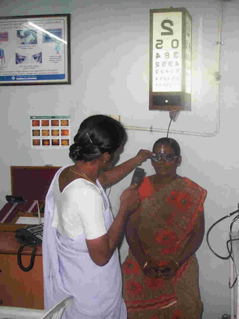 A woman receives an eye exam at one of Aravind's 36 small satellite eye care centers, in the village of Alanganallur, about 15 miles from Madurai.
