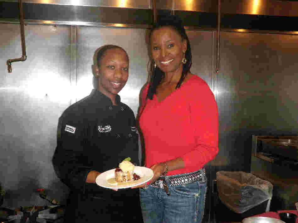 Executive Chef Karida Celestine and restaurateur B. Smith present their Bourbon Street Bread Pudding at Smith's eponymous restaurant in Washington, D.C. 