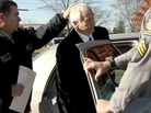 Gerald "Jerry" Sandusky, center, is placed in a police car in Bellefonte, Pa. on Saturday, Nov. 5. Gerald "Jerry" Sandusky, center, is placed in a police car in Bellefonte, Pa. on Saturday, Nov. 5.