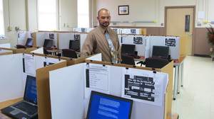 Felix Rios, a contractor with the Office of the Surgeon General, helps administer the ANAM test at Ft. Lewis, in Washington state.