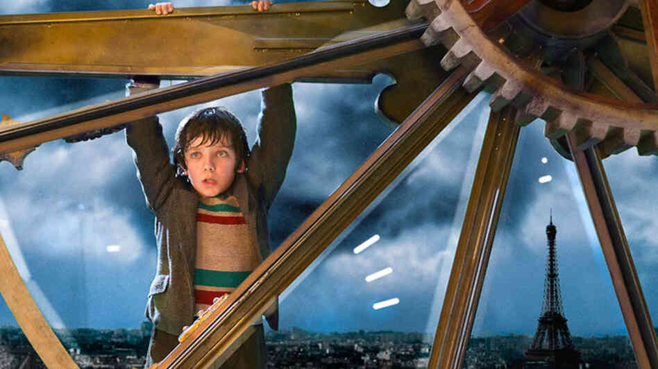 Gearhead: Orphan Hugo Cabret (Asa Butterfield) lives and breathes machines, servicing the train-station tower clock by day and sleeping in it by night. Gearhead: Orphan Hugo Cabret (Asa Butterfield) lives and breathes machines, servicing the train-station tower clock by day and sleeping in it by night.