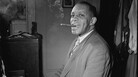 Willie "The Lion" Smith in his New York City apartment in 1947, smoking a signature stogie. Willie "The Lion" Smith in his New York City apartment in 1947, smoking a signature stogie.