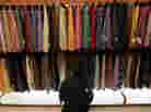 A man browses through ties at a Century 21 department store November 26, 2010 in New York City. 