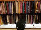 A man browses through ties at a Century 21 department store November 26, 2010 in New York City. 