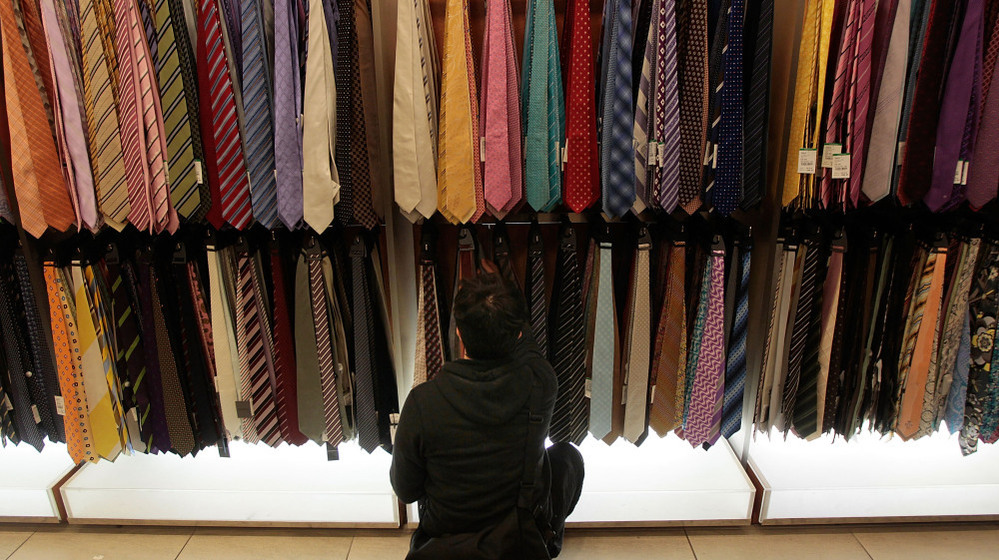 A man browses through ties at a Century 21 department store November 26, 2010 in New York City. 