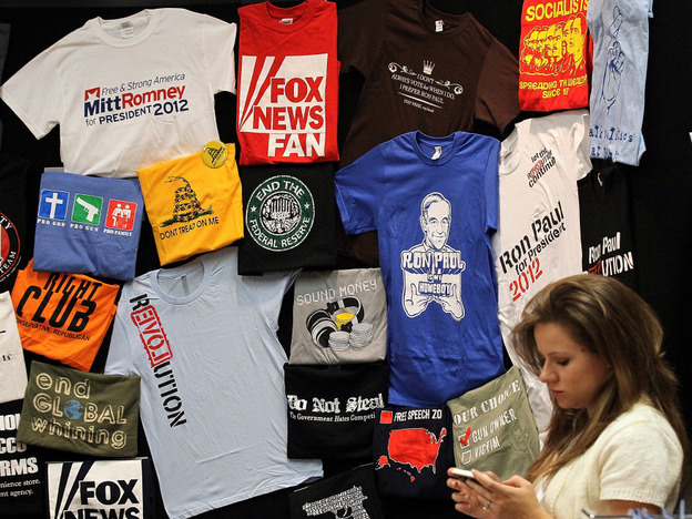 T-shirts on display at the 2011 Republican Leadership Conference in New Orleans in June. With the holidays approaching, campaigns and retailers are hawking plenty of political merchandise.