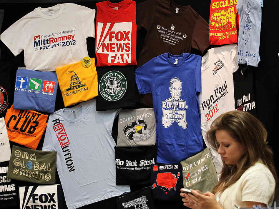 T-shirts on display at the 2011 Republican Leadership Conference in New Orleans in June. With the holidays approaching, campaigns and retailers are hawking plenty of political merchandise.