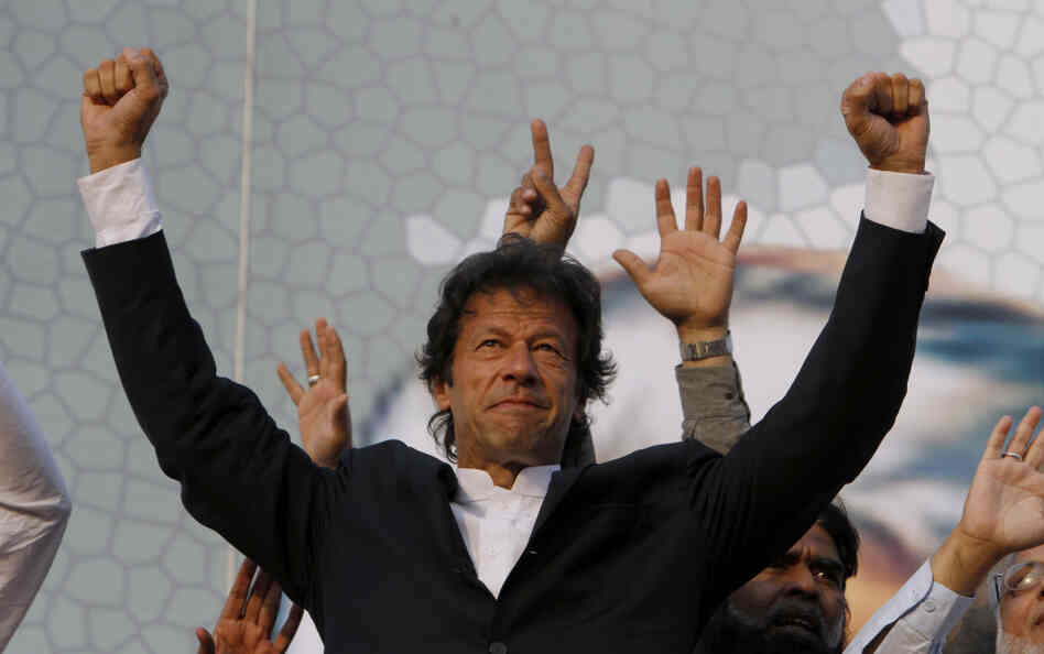 Former cricket star Imran Khan waves to supporters during a rally in Lahore, Pakistan, last month. Khan, who is campaigning to be prime minister, attracted a crowd of some 100,000 at the rally. 