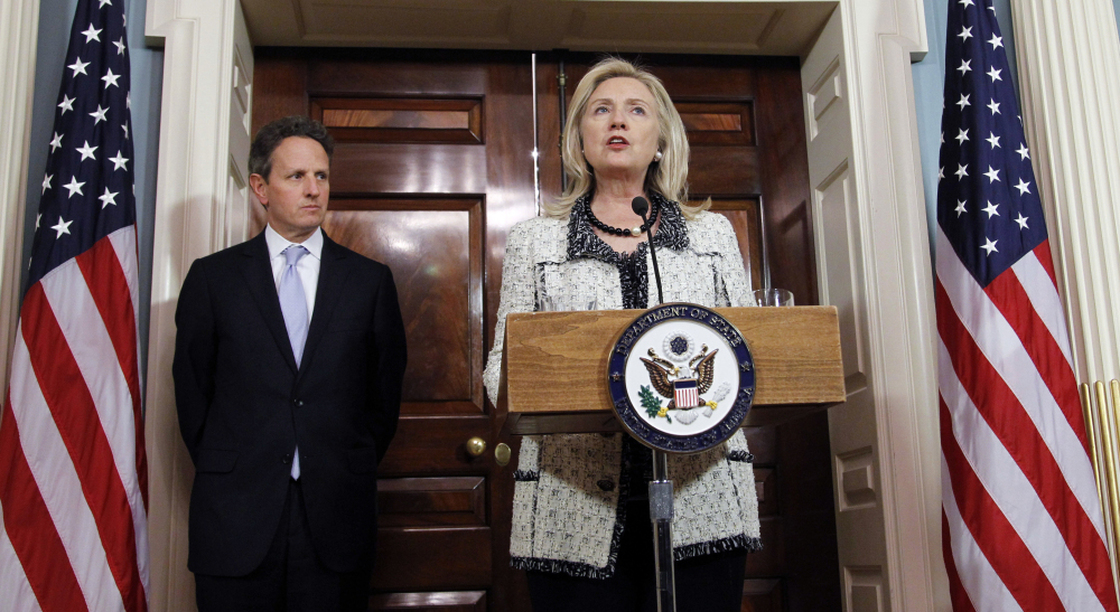 Secretary of State Hillary Clinton speaks while Treasury Secretary Tim Geithner looks on during a Nov. 21 news conference about new sanctions against Iran. 