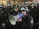 In this Nov. 15 file photo, police officers disperse Occupy Wall Street protesters near the encampment at Zuccotti Park in New York. In this Nov. 15 file photo, police officers disperse Occupy Wall Street protesters near the encampment at Zuccotti Park in New York.