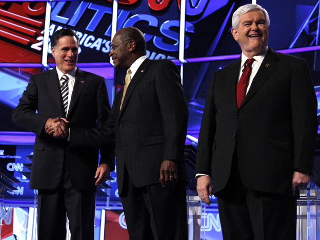 Mitt Romney, Herman Cain and Newt Gingrich before a GOP presidential debate in Washington, Tuesday, Nov. 22, 2011. 