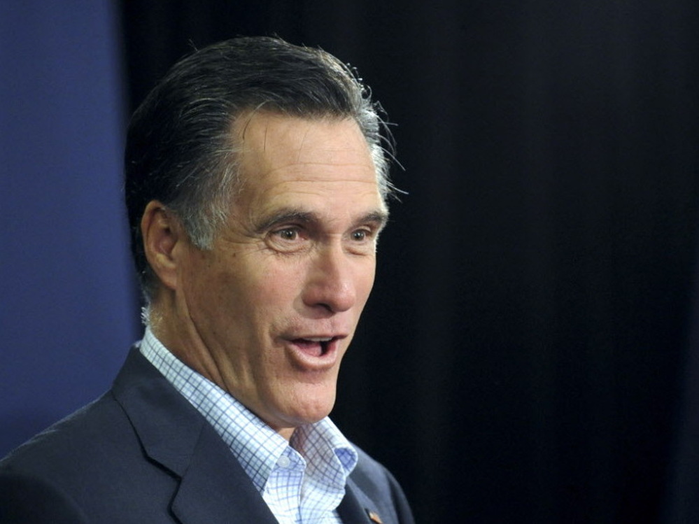 Former Massachusetts Gov. Mitt Romney speaks to a group of workers at Nationwide Insurance Company, Nov. 23, 2011, in Des Moines. A new poll suggests his religion could be an obstacle in the GOP primary.