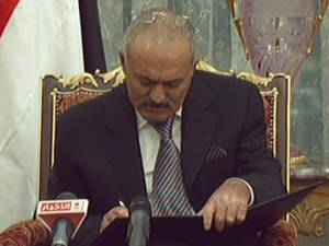 In this image from Saudi television, Yemeni President Ali Abdullah Saleh signs the Gulf Cooperation Council-sponsored transition deal Wednesday in the Saudi capital, Riyadh. In this image from Saudi television, Yemeni President Ali Abdullah Saleh signs the Gulf Cooperation Council-sponsored transition deal Wednesday in the Saudi capital, Riyadh.