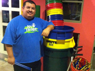 Mario Barela stands next to the supplies he uses for his percussion class. He teaches the fundamentals of drumming to children in a Phoenix domestic violence shelter. Mario Barela stands next to the supplies he uses for his percussion class. He teaches the fundamentals of drumming to children in a Phoenix domestic violence shelter.