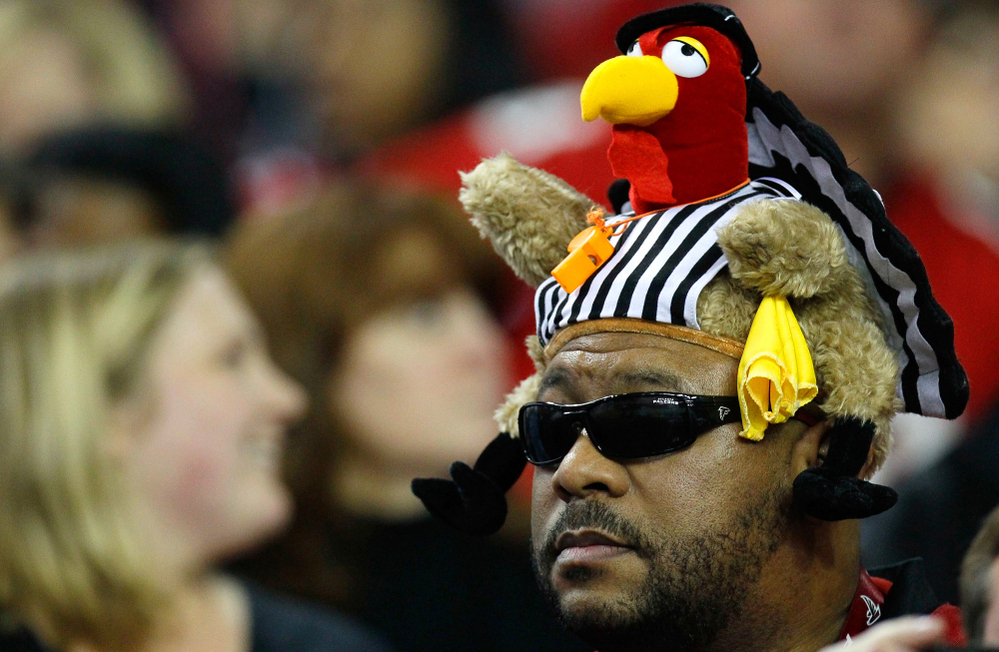 With five of Thursday's six teams owning winning records, the NFL's 2011 Thanksgiving Day games are creating some anticipation. In Atlanta, a fan got into the holiday spirit last week, wearing a turkey/referee hat.