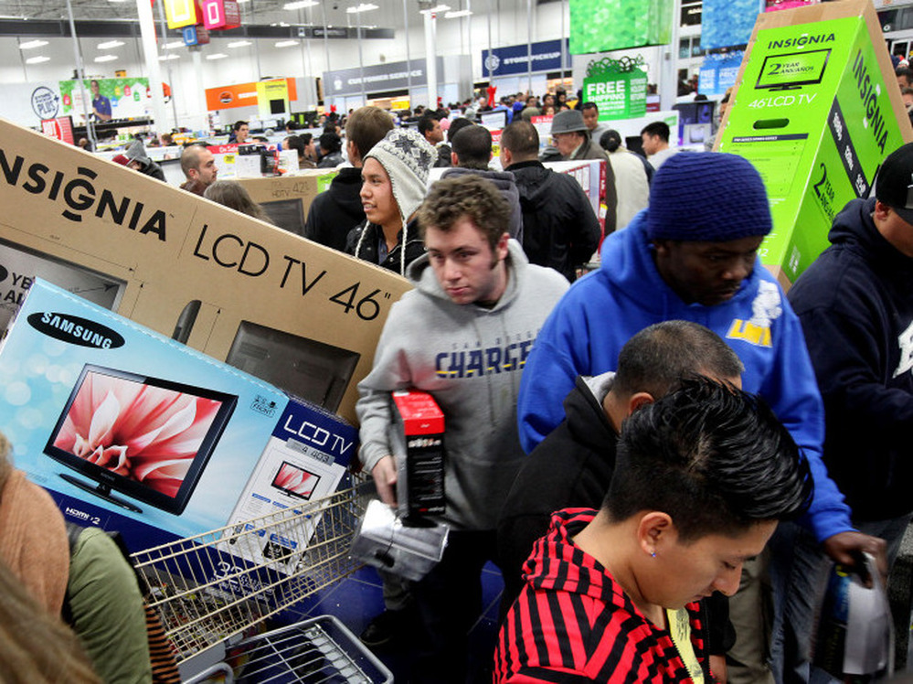 Customers shop for electronics items during Black Friday at a Best Buy in San Diego.