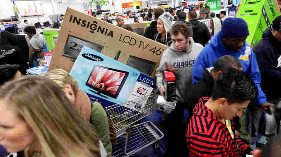 Customers shop for electronics items during Black Friday at a Best Buy in San Diego.