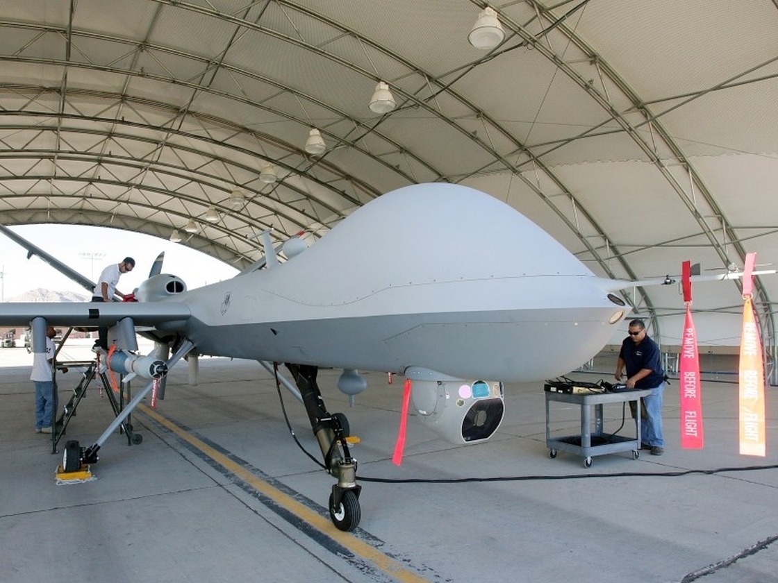 Mechanics prepare an MQ-9 Reaper for a training flight, Aug. 8, 2007, at Creech Air Force Base in Indian Springs, Nev. 