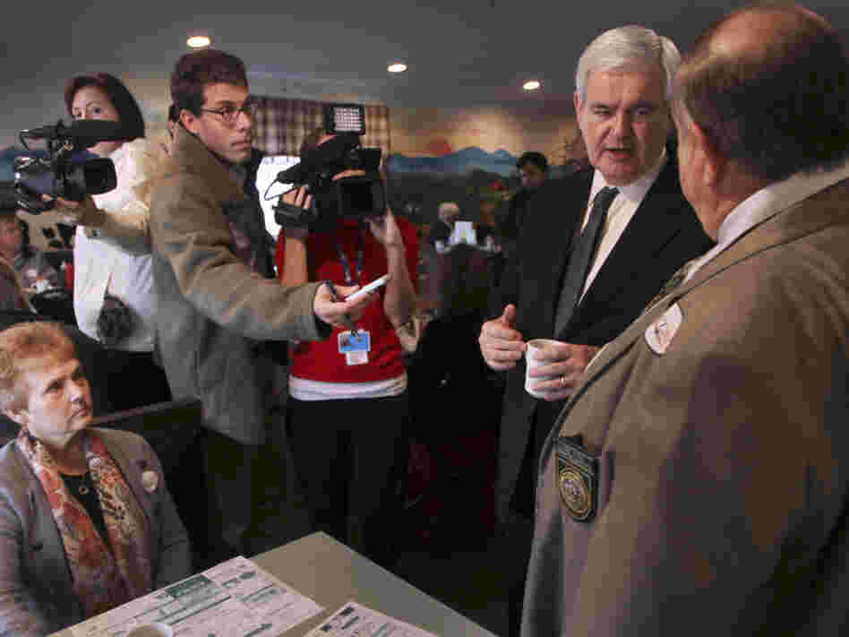 Newt Gingrich talks to New Hampshire State Rep. Joe Pitre during a campaign stop at the Circle Restaurant in Epson, NH.  Friday, Nov. 11, 2011.