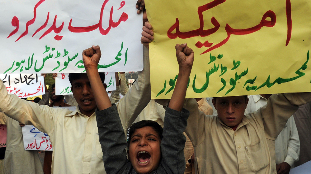 Pakistani boys in Lahore joined in a protest Sunday about the NATO attacks that killed 24 Pakistani soldiers.