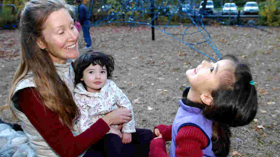 Michele Pereira, who questions the schedule of mandatory vaccines, sat with her daughters, Evangeline, 6, right, and Genevieve, 2, at a park in Ashland, Ore., earlier this month.