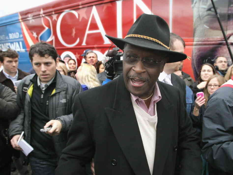 Herman Cain leaves the Big Sky Diner on Nov. 10, 2011 in Ypsilanti, Mich. 