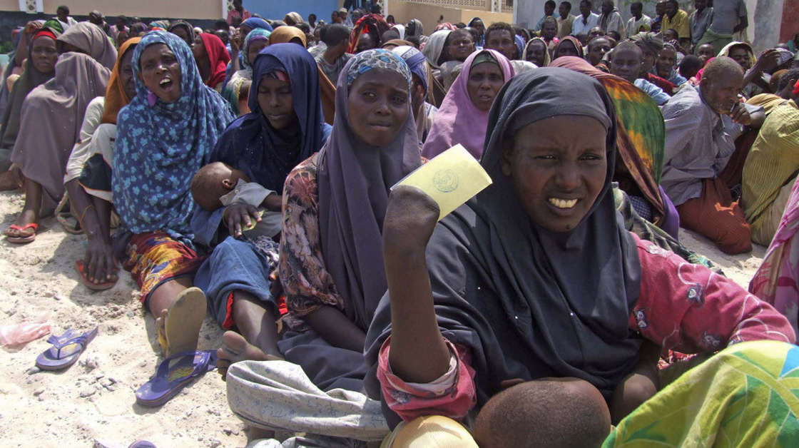 Somali civilians line up for food during the famine this year. Militants are banning relief agencies who warn a quarter of a million Somalis are at risk of starvation.