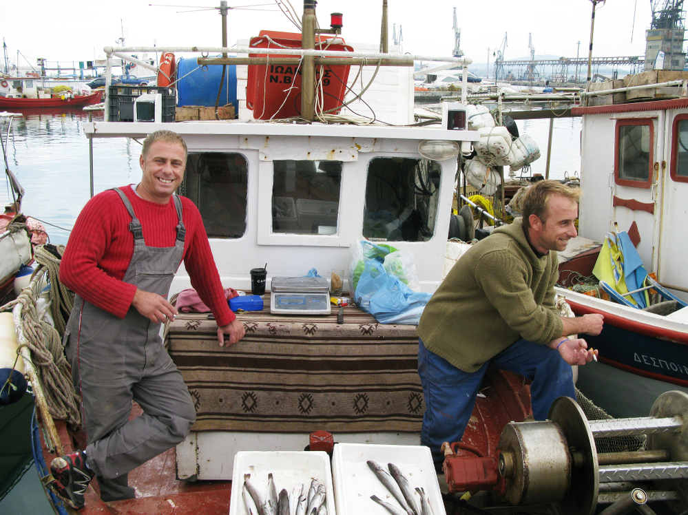 In the Greek village of Volos, fisherman Christos Xegandakis (left) jokes bitterly that times have gotten so tough that he may have to start swapping his fish for other goods. Others in Volos have already turned to barter systems, both formal and informal, in order to make ends meet.