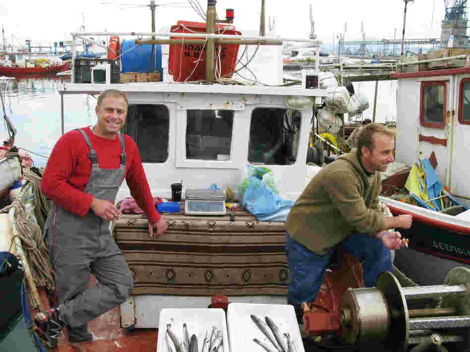 In the Greek village of Volos, fisherman Christos Xegandakis (left) jokes bitterly that times have gotten so tough that he may have to start swapping his fish for other goods. Others in Volos have already turned to barter systems, both formal and informal, in order to make ends meet.