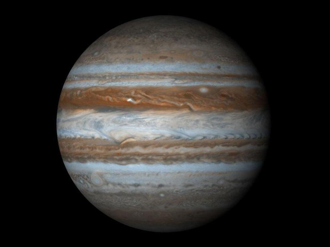 Displayed as a proper sphere, Jupiter shines like a jewel in the night, a giant pillar of color and power that towers above everything in solar system besides the sun itself.