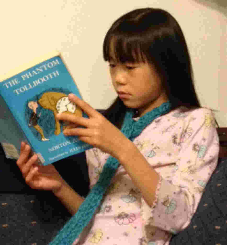 Sophie Hopp, 8, of Maple Valley, Wash., is reading The Phantom Tollbooth for the first time — it was one of her older brother's favorite books.