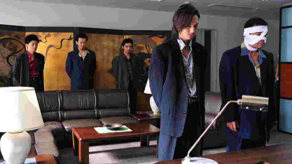After Takeshi's Otomo maims one of the Murase clan, Iizuka (Takashi Tsukamoto, left foreground) and Kimura (Hideo Nakono, bandaged) plan an in-kind response.