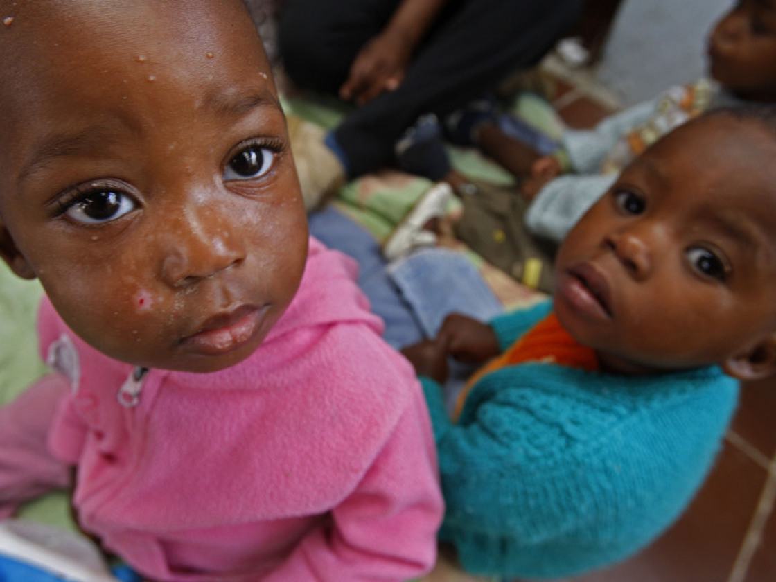 Orphaned children are cared for at the Baphumelele Center, which assists people affected by AIDS in South Africa. The Global Fund is short on AIDS funding, preventing it from funding new programs.