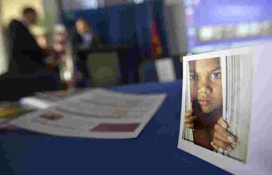 A placard of a child sits on a table during a conference Oct. 31 on human sex trafficking in Atlanta. The Georgia Department of Education estimates that about 5,000 girls in the state are at risk for trafficking each year. 