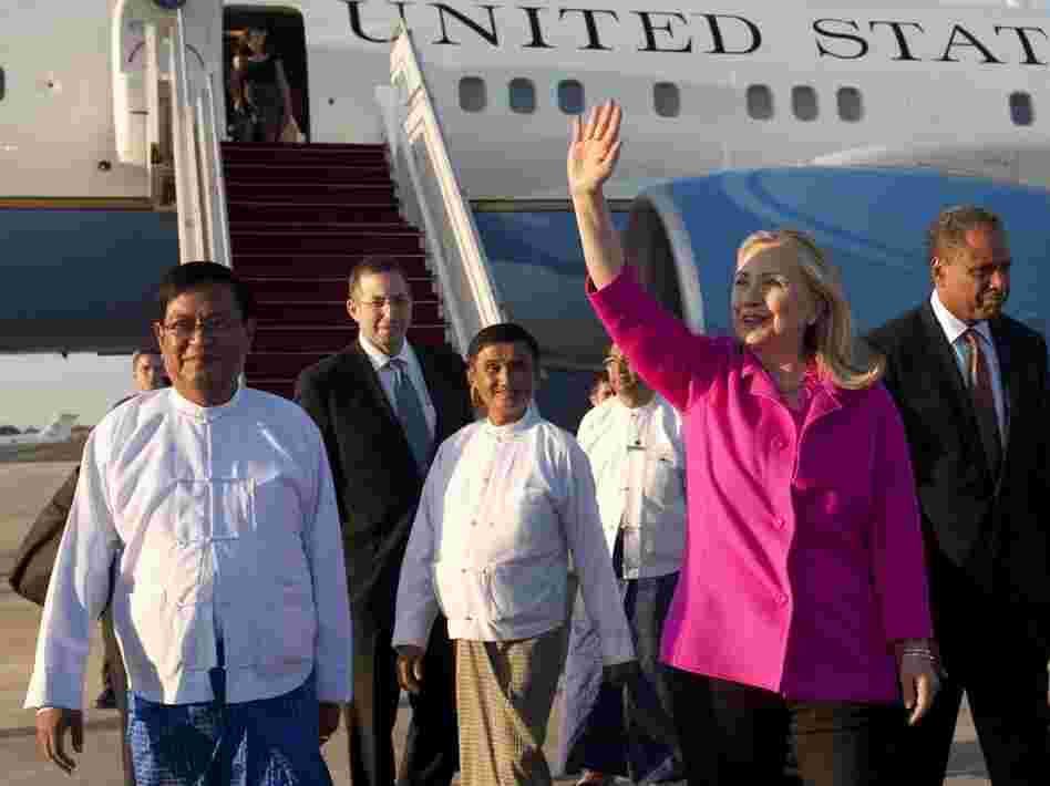 U.S. Secretary of State Hillary Clinton (C) walks on the tarmac upon her arrival in Myanmar on Wednesday. Clinton arrived on the first top-level US visit for half a century. 