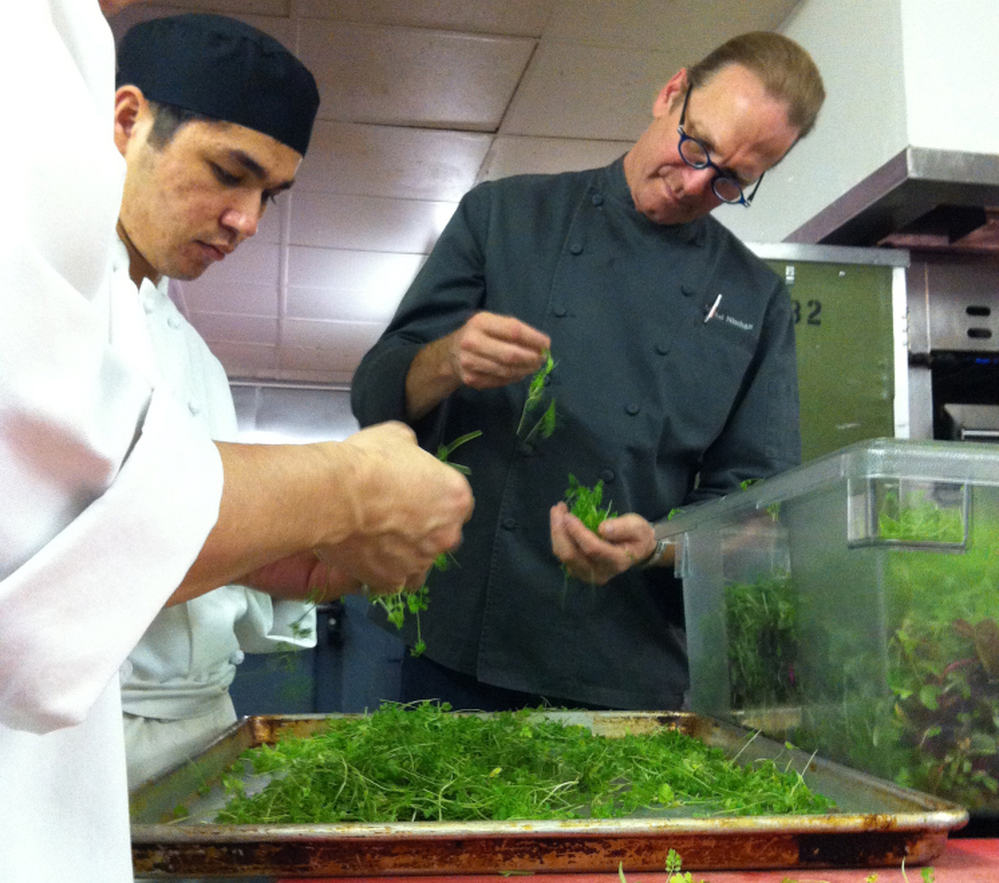  Michel Nischan and assistants prepare herbs for his chopped herb salad. 
