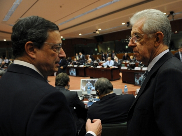 European Central Bank Chief Mario Draghi speaks with Italian Prime Minister Mario Monti at EU headquarters in Brussels on Wednesday. European leaders will meet there next week to discuss their options for fixing the region's sovereign debt crisis.