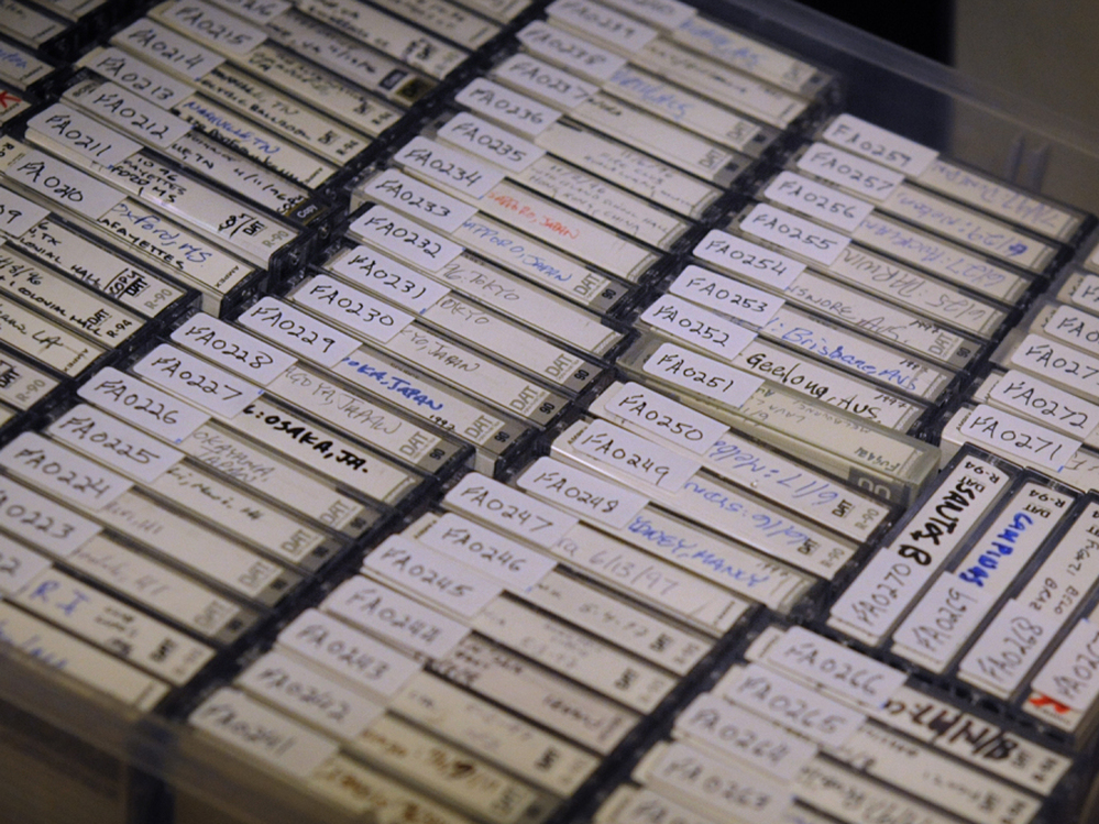A few of the hundreds of tapes recorded on the road by Fugazi's sound engineers.