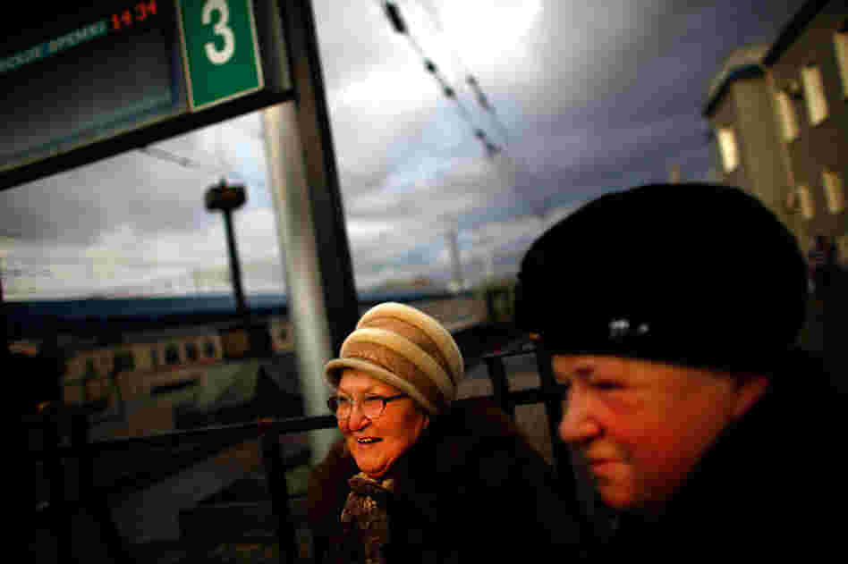 Tamara Ostrovskaya (left) and her sister-in-law, Albina Ostrovskaya (right), stand on the train platform at Yaroslavsky Rail Terminal in Moscow.