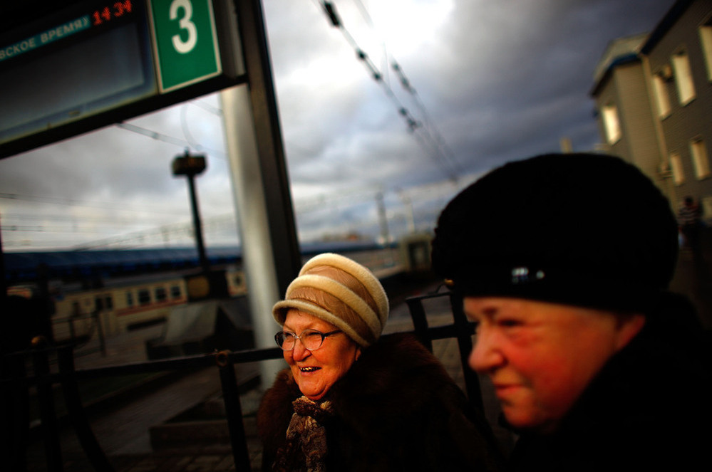 Tamara Ostrovskaya (left) and her sister-in-law, Albina Ostrovskaya (right), stand on the train platform at Yaroslavsky Rail Terminal in Moscow.