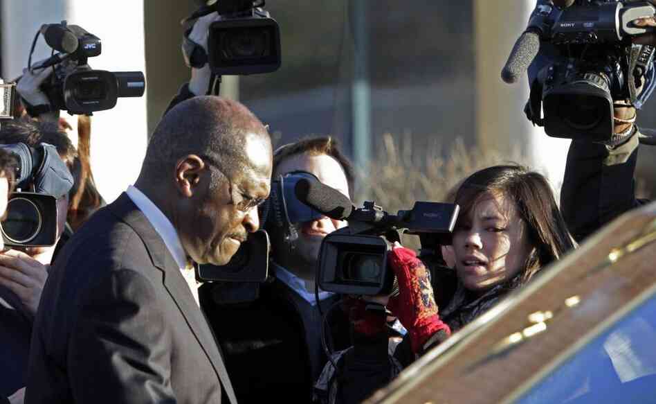 Herman Cain leaving the New Hampshire Union Leader newspaper after meeting with its editorial board, Thursday, Dec. 1, 2011.