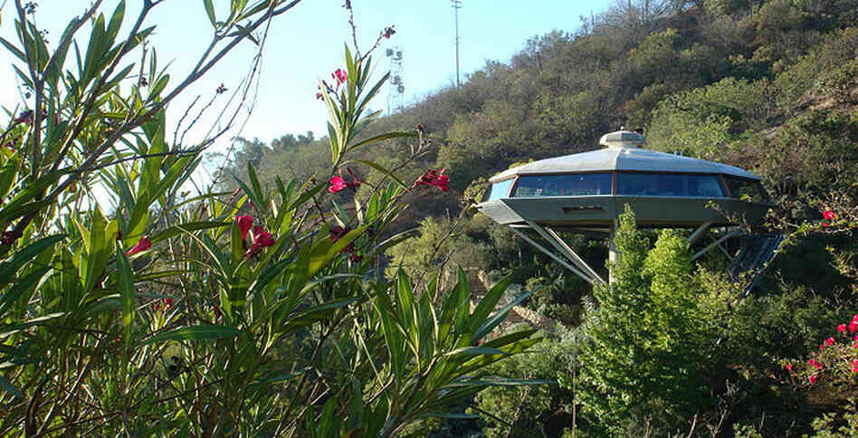 Designed in 1958, architect John Lautner's Chemosphere House perches atop a 29-foot concrete pole on a roughly 45 degree slope in California's Hollywood Hills and is accessible via funicular. Designed in 1958, architect John Lautner's Chemosphere House perches atop a 29-foot concrete pole on a roughly 45 degree slope in California's Hollywood Hills and is accessible via funicular.