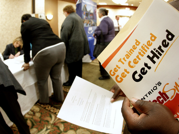 Job seekers attend a career fair in Overland Park, Kan., Dec. 1, 2011. 