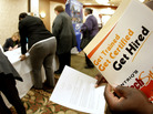 Job seekers attend a career fair in Overland Park, Kan., Dec. 1, 2011. Job seekers attend a career fair in Overland Park, Kan., Dec. 1, 2011.