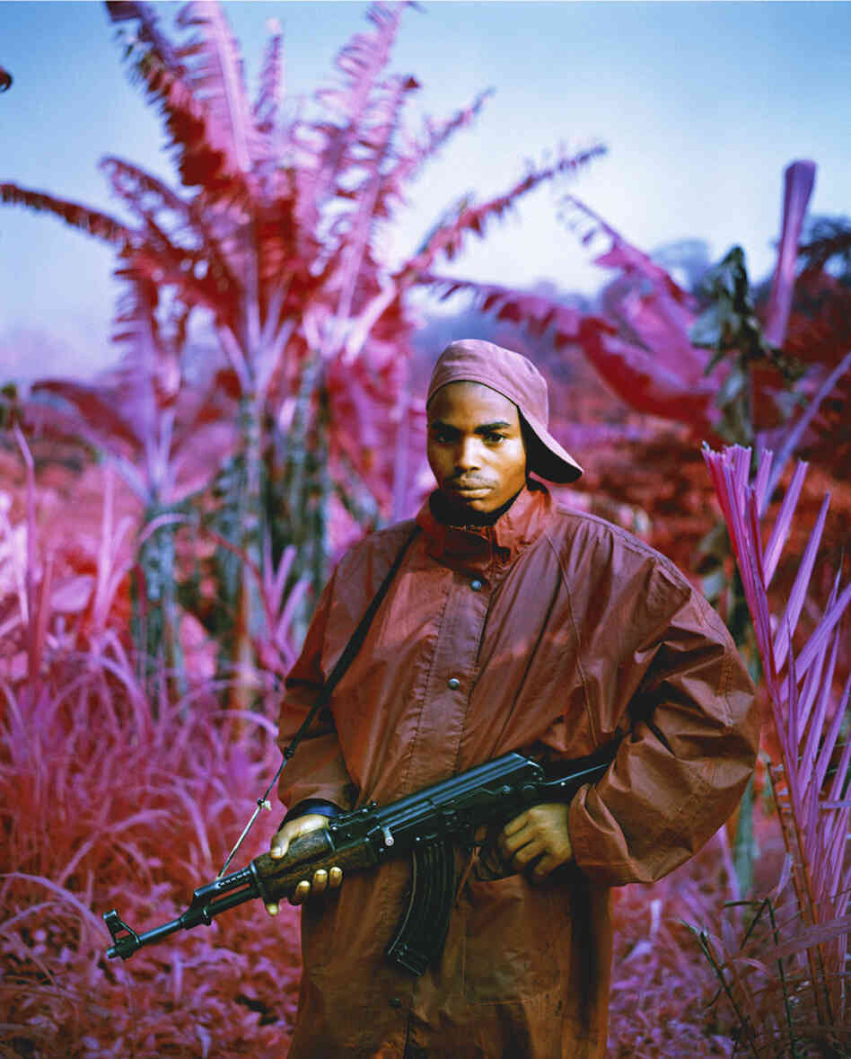 Infrared Kodak film renders certain colors in magenta. Many rebels still roam the countryside of the Democratic Republic of Congo, which has been plagued by violence for much of the past 15 years, including this fighter in North Kivu, in the far east of the country. (She Brings the Rain, 2011) Infrared Kodak film renders certain colors in magenta. Many rebels still roam the countryside of the Democratic Republic of Congo, which has been plagued by violence for much of the past 15 years, including this fighter in North Kivu, in the far east of the country. (She Brings the Rain, 2011)