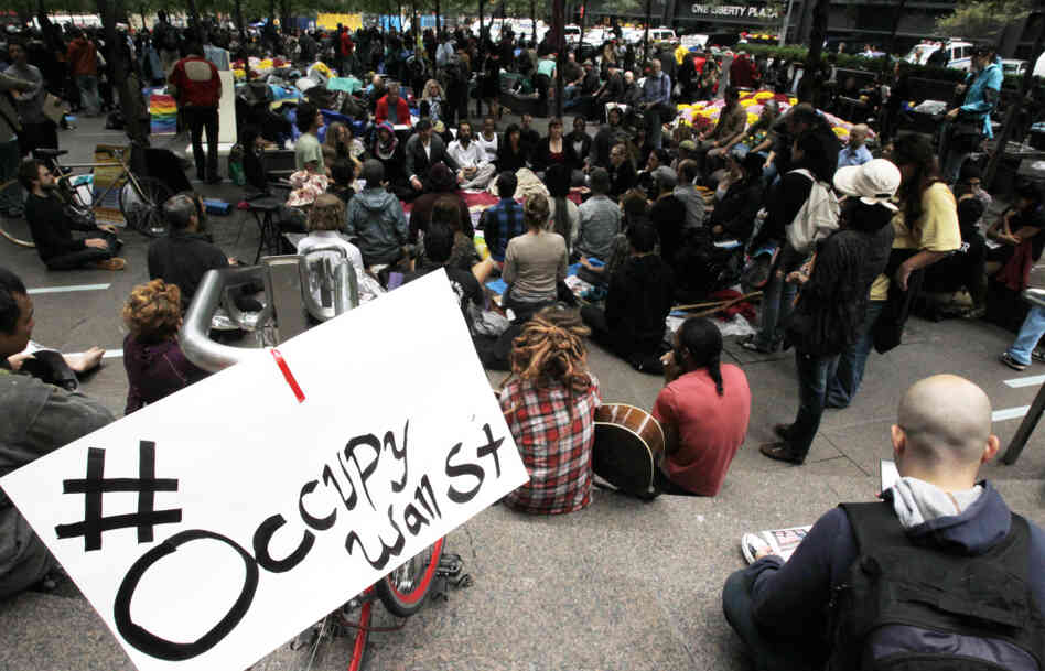 Occupy Wall Street protesters meditate while a sign bearing their Twitter hashtag hangs from a railing in Zuccotti Park in October. Some activists accused Twitter of censorship because #OccupyWallStreet wasn't appearing on trending lists. Occupy Wall Street protesters meditate while a sign bearing their Twitter hashtag hangs from a railing in Zuccotti Park in October. Some activists accused Twitter of censorship because #OccupyWallStreet wasn't appearing on trending lists.