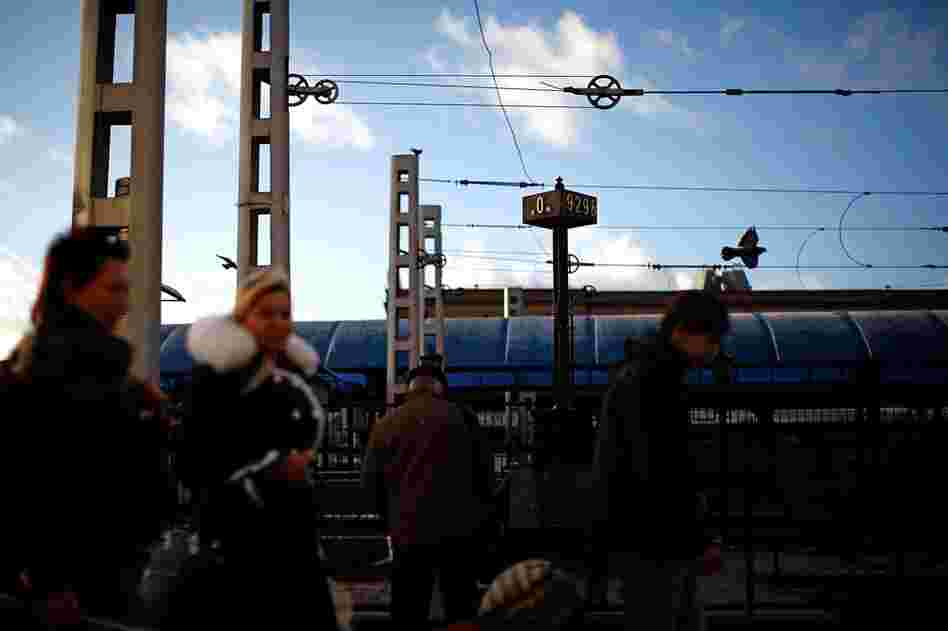 Passengers rush past the "0" marker signifying the start of the Trans-Siberian railroad on the loading platform at the Yaroslavsky Rail Terminal in downtown Moscow. The Trans-Siberian rail line starts at this station and snakes its way across Russia through the country's major cities, ending at the Pacific Ocean. 