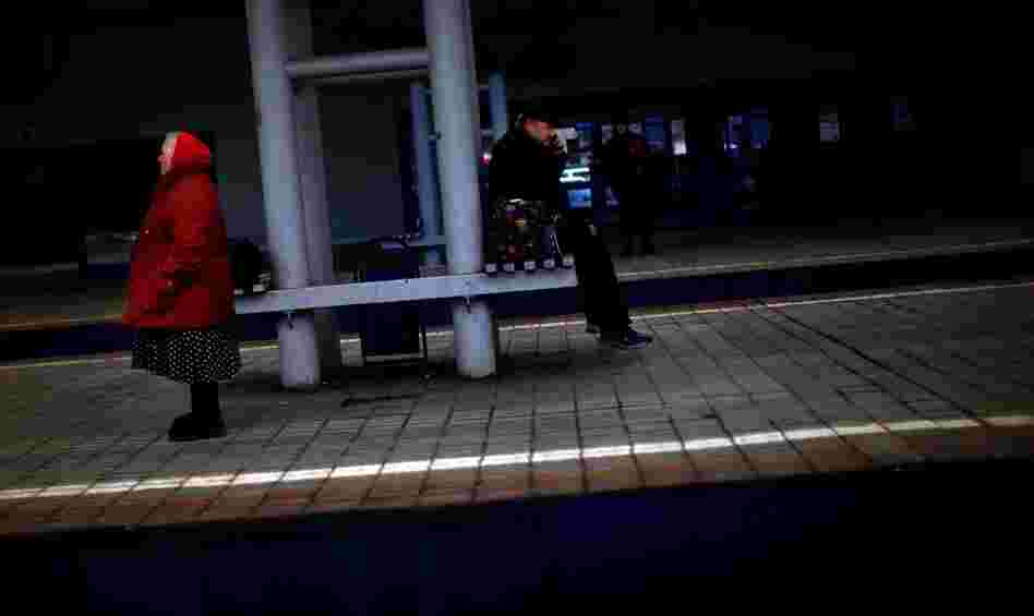 Passengers wait on a train platform at Yaroslavsky Rail Station in Moscow. 